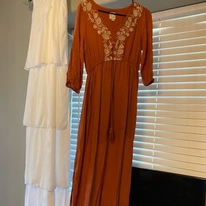 Burnt orange maxi dress with embroidered flowers.